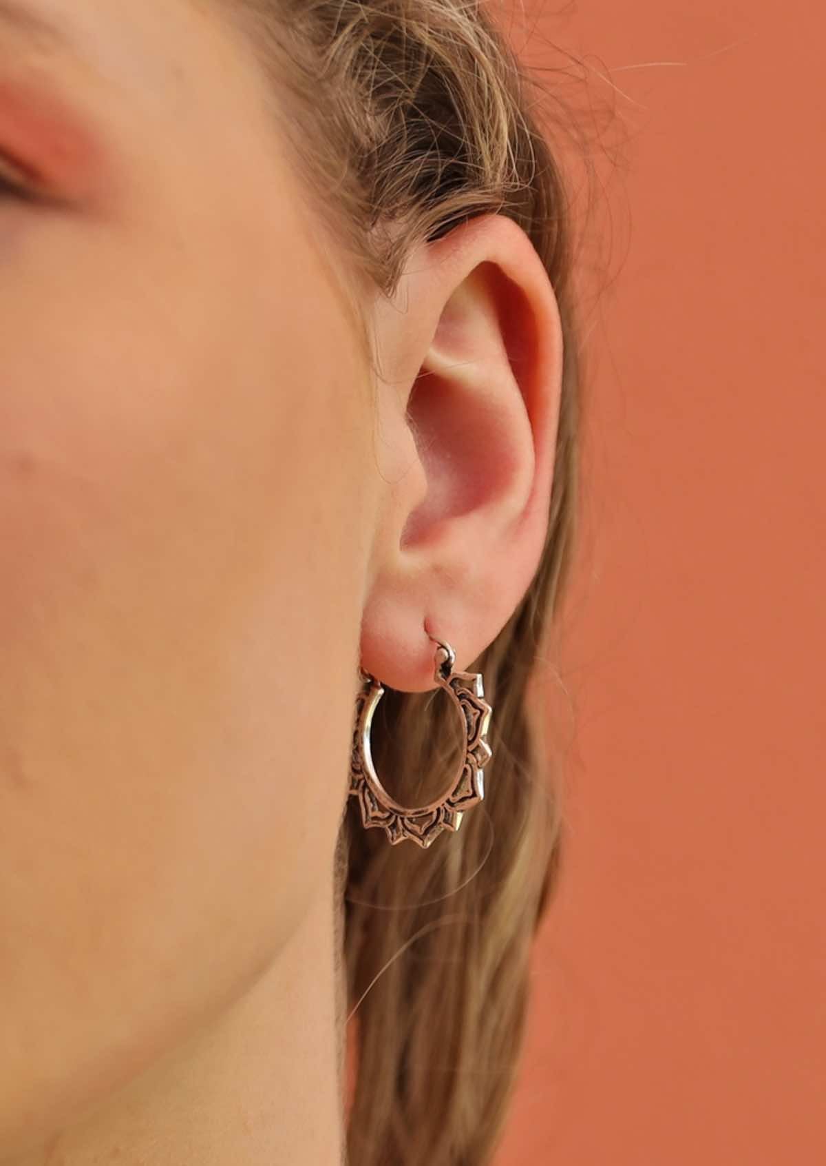 woman wearing silver boho decorative hoop style earrings perfect for wedding
