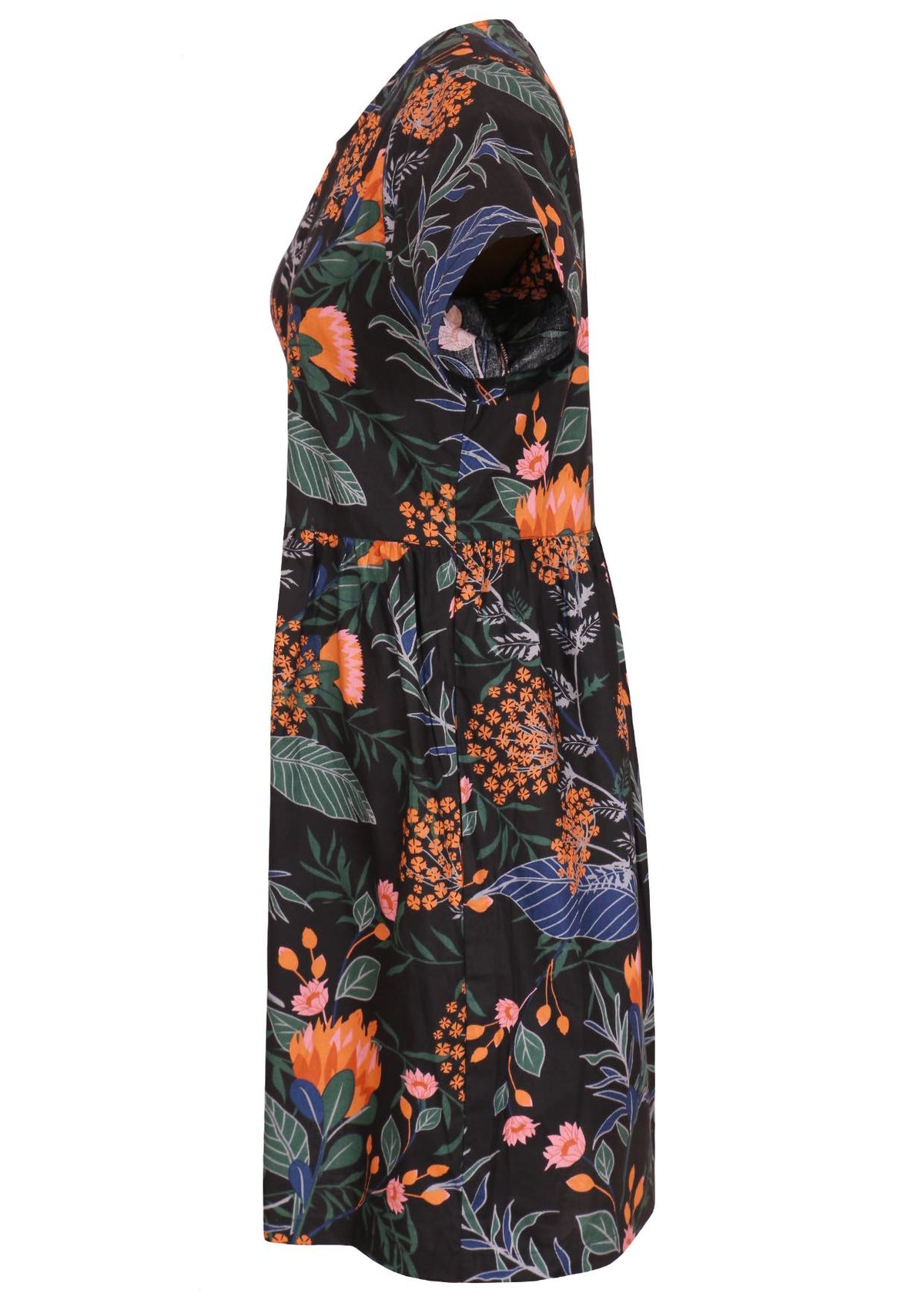 Side view of loose fitting cotton dress in black with short sleeves and hidden side pockets