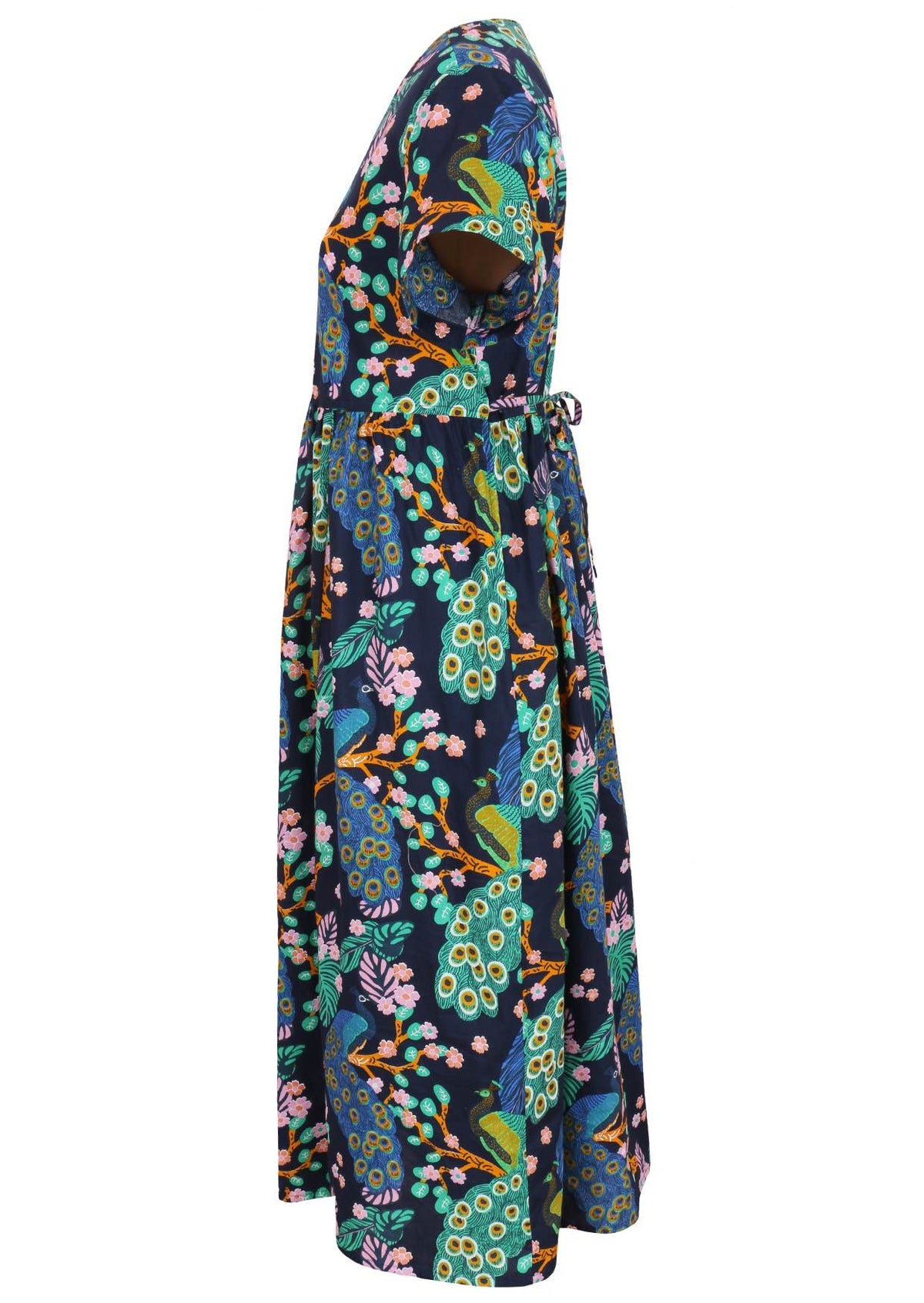 Side view of navy blue based floral print V-neck cotton dress with pockets.