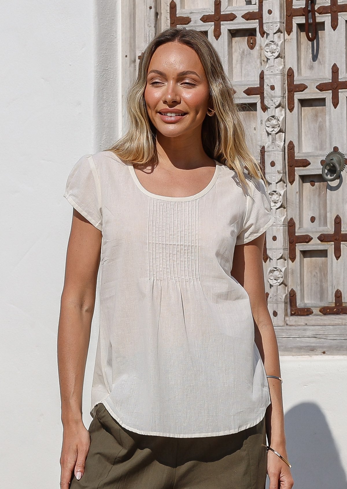 Tulsi Top cap sleeve u-shaped neckline decorative pleats from neckline curved bottom hem 100% cotton natural white