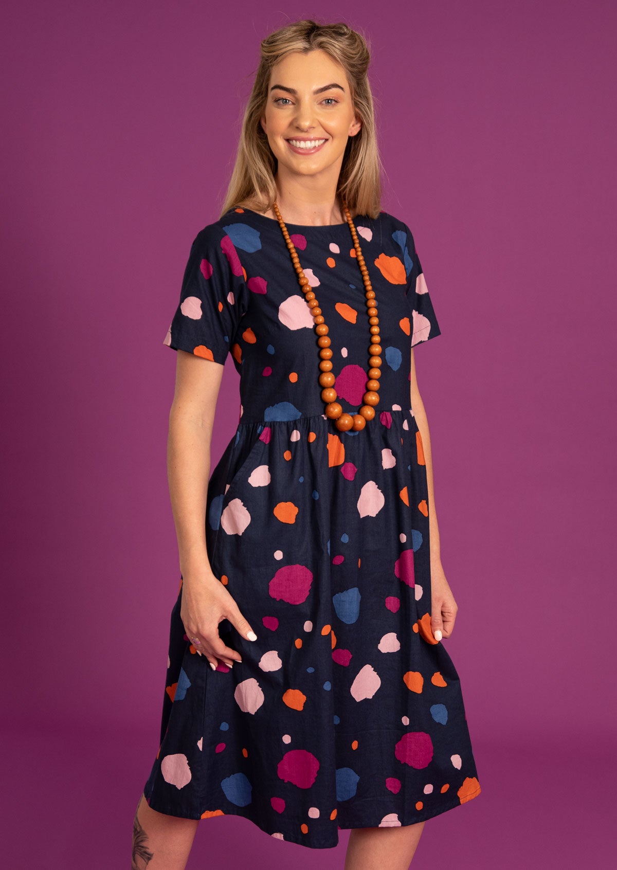 100% cotton irregular spotty print, midlength dress featuring short sleeves and pockets.
