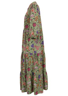 Green based multi-coloured folk style floral print cotton dress on white background.