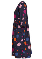 Side view of 100% cotton knee length dress with 3/4 sleeves and pockets.