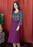 woman wearing purple corduroy aline skirt  with purple cotton top