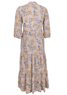 Back view of a full length maxi dress with 3 tiered flowy skirt, mandarin collar, buttoned bodice and pockets