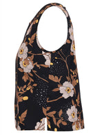 side view of black based floral print cotton sleeveless top.