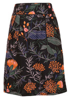 100% cotton knee length pencil skirt in bold botanical print with side zipper and piped details across the waist and pocket