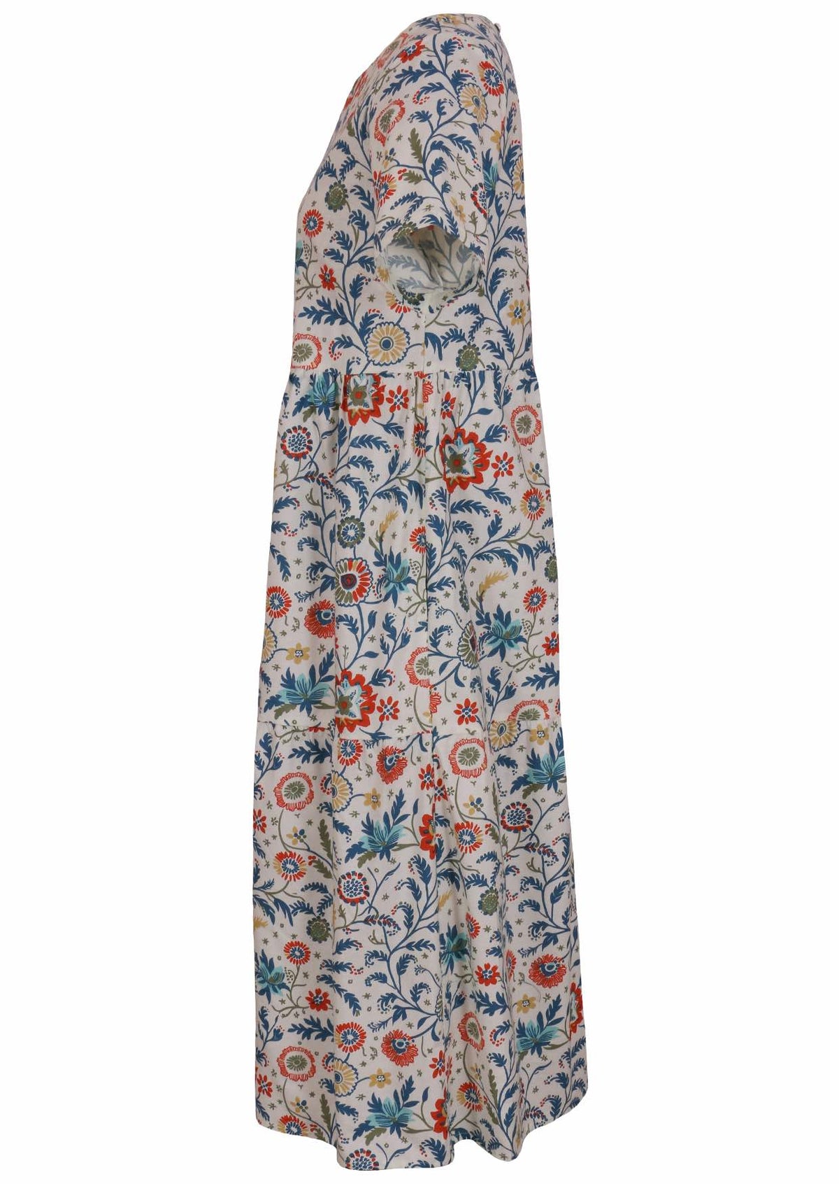 Side view of cotton short sleeved midi length dress with empire waist and tiered skirt in white based floral print 