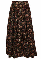 Front mannequin photo of black cotton midi length button through skirt with box pleats, belt loops and pockets