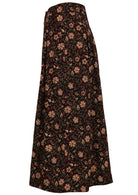 side mannequin photo of black cotton midi length button through skirt with box pleats, belt loops and pockets