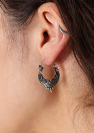 Sophisticated silver earrings with hinged wire closure