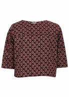 Image of a 100% cotton 3/4 sleeve boxy top in dark purple based floral pattern.