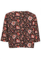 Loose fit, boxy cotton top with 3/4 sleeves   and decorative buttons down at the center of the back.