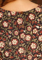 Model wears a relaxed-fit cotton top in a beautiful floral print, finished with decorative buttons down the back.