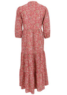 Back view of a full length maxi dress with 3 tiered flowy skirt, mandarin collar, buttoned bodice and pockets