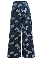 Blue, green and white floral print on a dark blue base cotton corduroy pants with a wide waistband