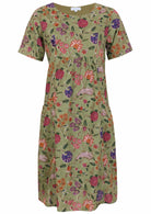 Green based multi coloured folk art style florals cotton dress on a white background.