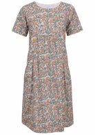 Front view of cotton dress with round neckline in white based floral print
