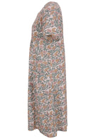 Side view of cotton dress with round neckline and short sleeves in white based floral print. 