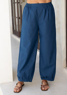 Close up of blue cotton pants showing the elastic in the sides of the waistband
