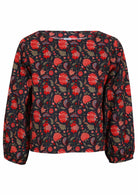 Cotton long sleeve top with bishop sleeves in red and green floral print on a navy base