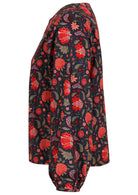 Cotton long sleeve top with boat neckline and bishop sleeves, in floral print on a blue base