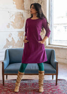 Woman wearing 100% cotton 3/4 sleeve corduroy shift dress with hands in pockets