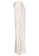 Natural white 100% cotton wide-leg pants with elastic back waist and pockets.