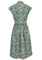 Back view of sage green based floral print cotton cap sleeves dress.