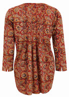 Long sleeve cotton floral print top with multiple small pleats in centre of the back