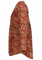 100% cotton top with long sleeves and pin tucks across the bodice that lead to A Line flare
