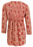 gentle cream based floral print cotton button through shirt with long sleeves, and pin tucks across the bodice, front and back