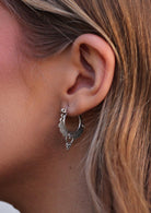 woman's ear with silver hill tribe hoop earring 