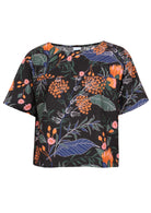 100% cotton boxy style top with high round neckline, short sleeves and seam across the bust in black based botanical protea print