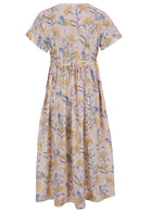 Back view of neutral based blue and golden floral print V-neck cotton dress with pockets.
