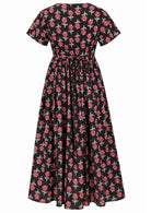 Back view of black based floral print V-neck cotton dress with pockets.