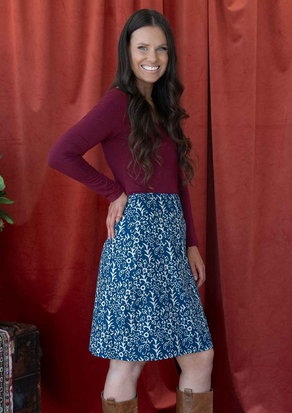 Model is wearing a 100% cotton, knee length reversible skirt with side zipper.