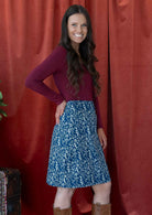 Model is wearing a 100% cotton, knee length reversible skirt with side zipper.