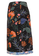 Mid length reversible skirt in beautiful black botanic queen protea print with the pop of dusty blue floral printed band on the base