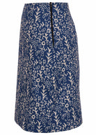 Side image of midlength cotton reversible skirt in blue based floral print with side zipper.