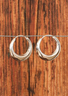 Thick silver hoop earrings
