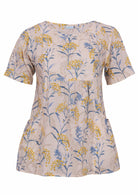 Relaxed fit 100% cotton top in neutral based floral print with short sleeves, pockets and gathers under the bust