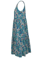 Side mannequin photo of cotton sleeveless three tiered dress in floral print on a royal blue base with hidden side pockets