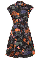 Knee length black shirt style collared dress with buttoned bodice, cap sleeves and a fabric waist tie 