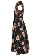 Side view of 50's style cotton button through midi length dress with a waist tie and hidden side pockets