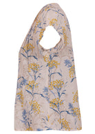 Side view of neutral based floral print 100% cotton top with cap sleeves