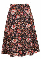 Black based traditional Indian floral print cotton skirt on a white background.