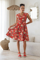 Model wears a 100% cotton dress featuring cap sleeves, pockets and a generous A-line skirt.
