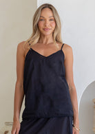 Black cotton cami with V-neck, thin straps, worn by model