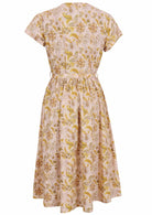 Back view of 50's style cotton midi length dress with a waist tie and cap sleeves